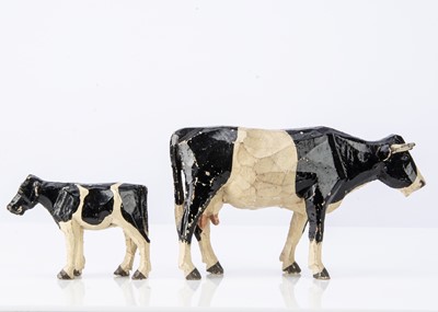 Lot 420 - A Forest Toys of Brockenhurst cow and calf