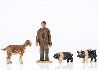 Lot 430 - A Forest Toys of Brockenhurst man, two pigs and a goat