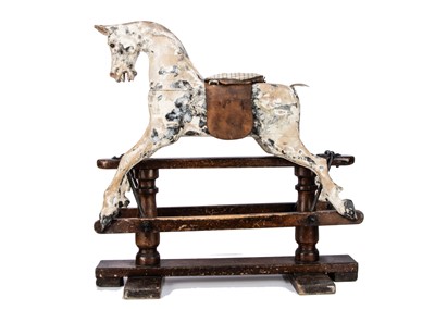 Lot 480 - A small English carved and painted wooden rocking horse