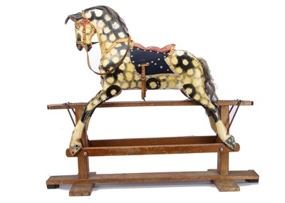 Lot 486 - A small English carved and painted wooden rocking horse