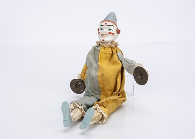 Lot 501 - A German bisque headed white faced clown toy