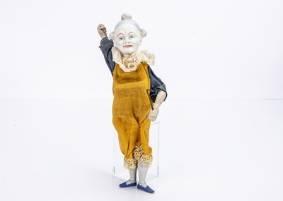 Lot 504 - A German bisque headed white faced clown toy