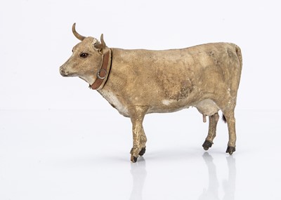 Lot 530 - A late 19th century skin covered cow on wheels