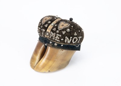 Lot 564 - A late 19th century pinned bead and hoof pincushion