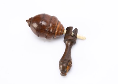 Lot 599 - An 19th century turned Coquilla nut whistling spinning top