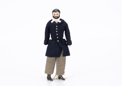 Lot 620 - An 19th century bisque shoulder-head male dolls’ house doll