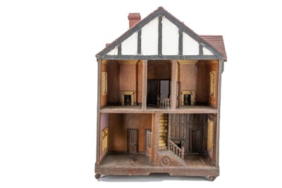 Lot 633 - An unusual 1930s well-modelled mock Tudor dolls’ house