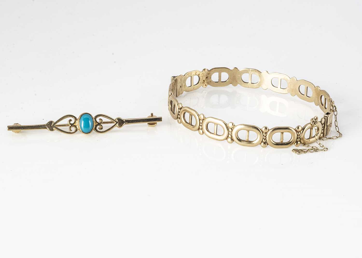 Lot 275 - A 9ct gold oval openwork bangle