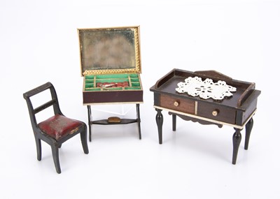 Lot 641 - Three pieces of Waltershausen type dolls’ house furniture