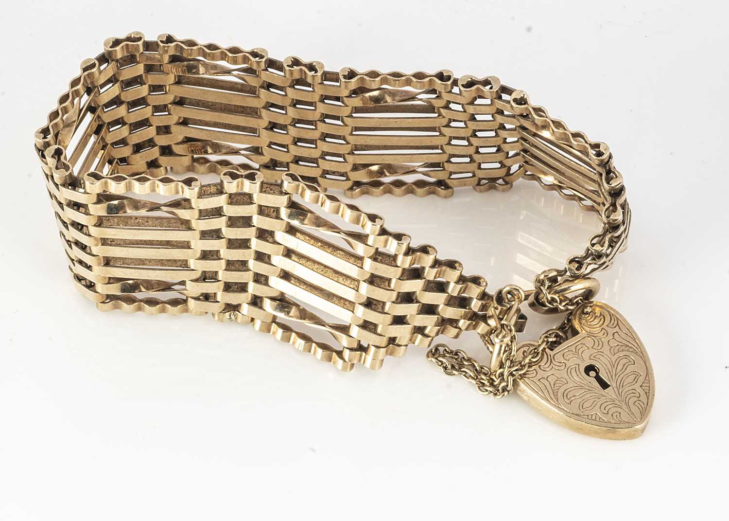 Gate Bracelets Lot 278 - A 9ct gold seven bar gate link bracelet,