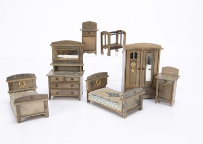 Lot 677 - A 1920s German grey stained dolls’ house bedroom set