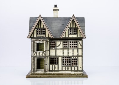 Lot 680 - A small 1930s German wooden dolls’ house