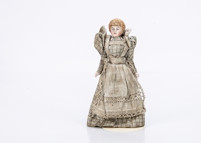 Lot 696 - A late 19th century bisque shoulder-head dolls’ house lady doll