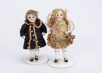 Lot 701 - Two German all-bisque dolls’ house dolls