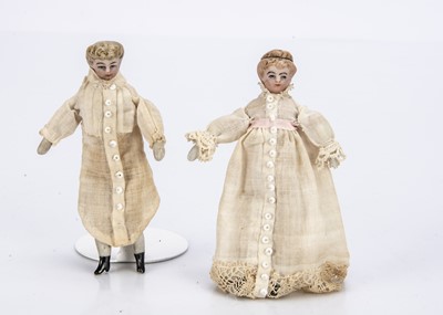 Lot 703 - Two German bisque shoulder-head dolls’ house boy and girl doll