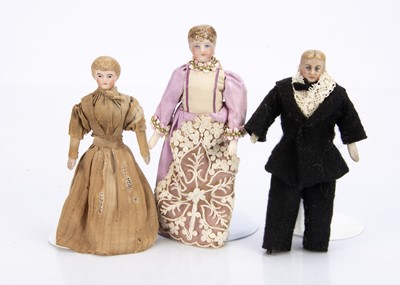 Lot 705 - Three Edwardian bisque shoulder-head dolls’ house dolls