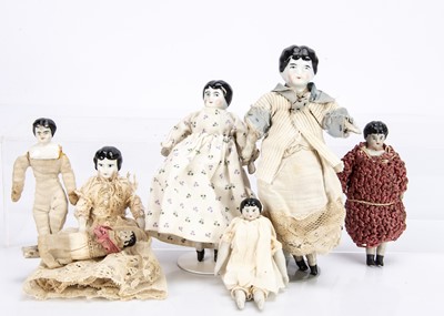 Lot 708 - Four china shoulder-head dolls house dolls