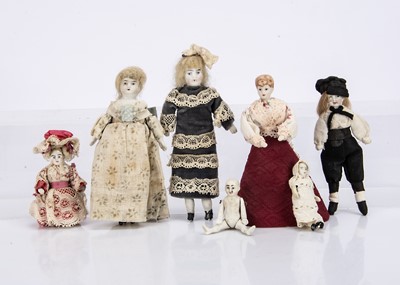 Lot 709 - Two white all-bisque dolls' house dolls