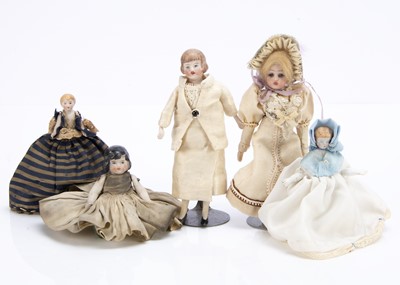 Lot 710 - Five various dolls’ house dolls