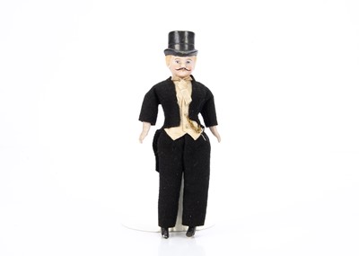 Lot 734 - A German bisque shoulder-head dolls’ house gentleman doll with moulded top hat