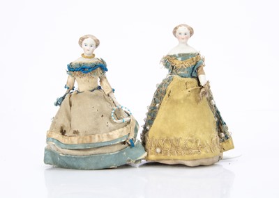 Lot 737 - A pair of 19th century bisque shoulder-head dolls’ house dolls