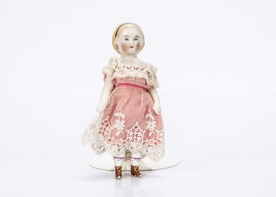 Lot 740 - A rare 19th century bisque Frozen Charlotte dolls’ house doll