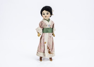 Lot 789 - A small German Asian child doll