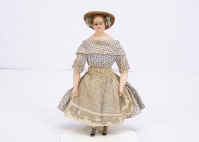 Lot 815 - A mid 19th century small poured wax child doll