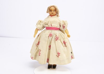 Lot 816 - A 19th centry small poured wax child doll