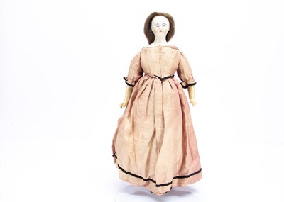 Lot 825 - An 19th century German wigged china shoulder-head doll