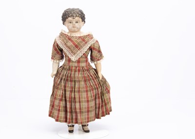 Lot 838 - A 19th century German papier-mâché shoulder-head child doll