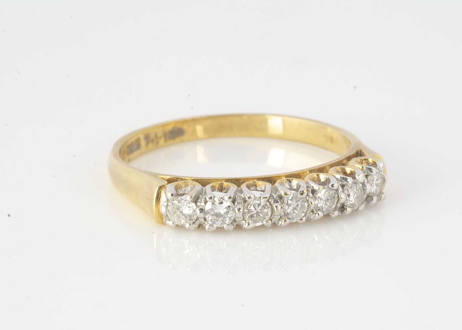 Lot 294 - An 18ct gold seven stone diamond dress ring