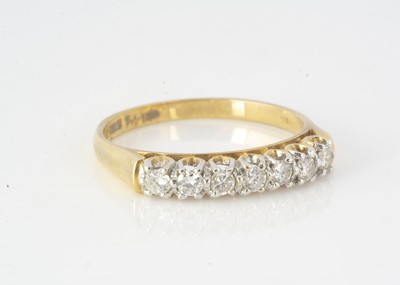 Lot 294 - An 18ct gold seven stone diamond dress ring