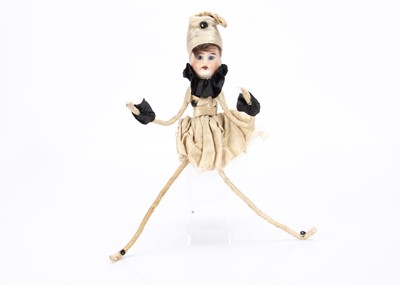 Lot 867 - A German bisque headed doll dressed a female Pierrot