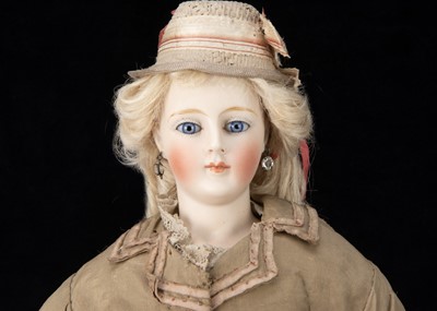 Lot 882 - A rare and interesting German bisque shoulder head fashionable doll