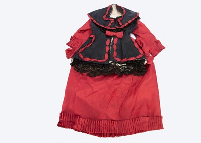 Lot 887 - A late 19th century red and black large size doll’s dress