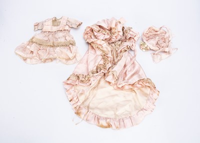 Lot 888 - A late 19th century pink silk doll’s outfit