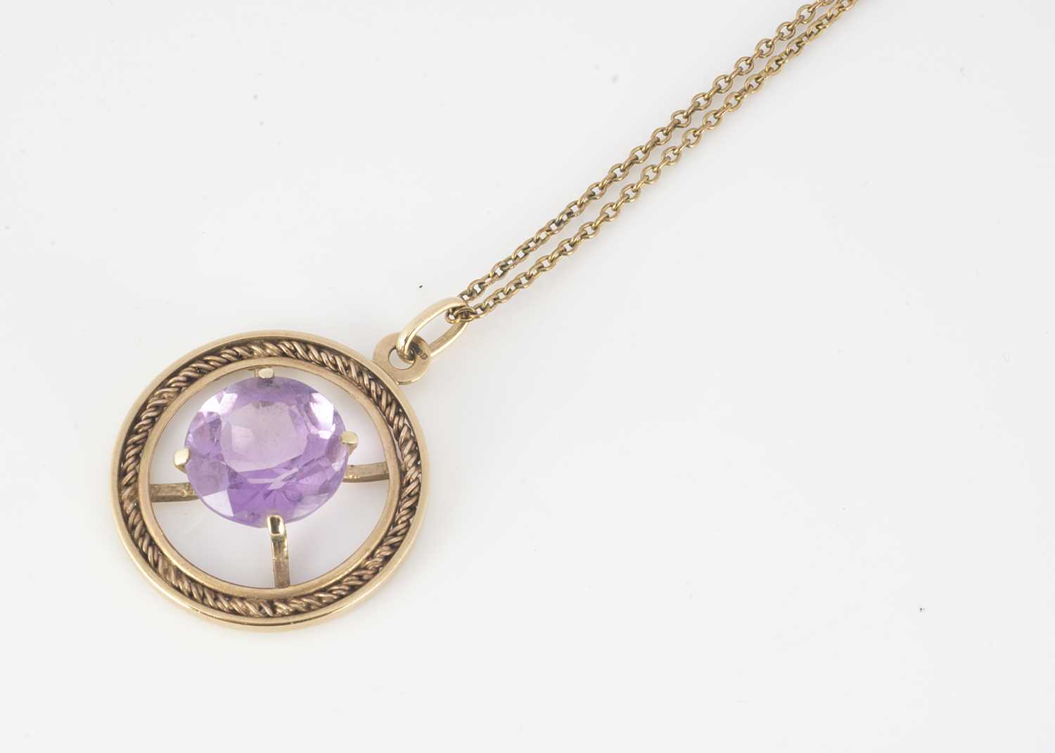 Lot 299 - A 9ct gold amethyst openwork drop pendant and chain