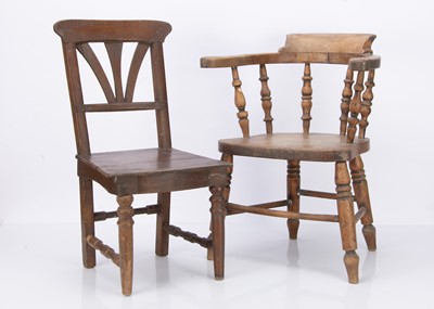 Lot 910 - An early 20th century child’s bow back captain’s chair