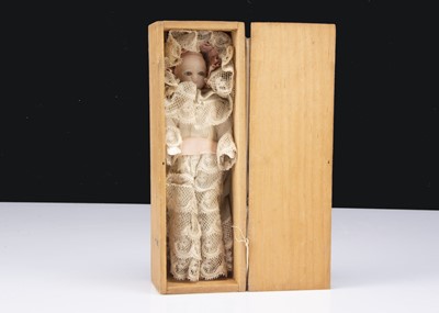 Lot 919 - A small German wax shoulder headed baby doll in wooden box