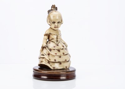 Lot 920 - A Continental solid wax girl in party dress mounted on circular wooden box