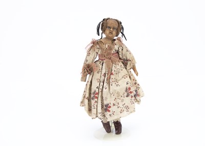 Lot 926 - A mid 18th century English small poured wax shoulder-head doll