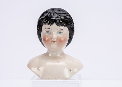 Lot 942 - An unusual German two-face pink tinted china shoulder head doll