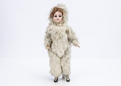 Lot 990 - An unusual bisque headed eskimo doll