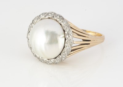 Lot 312 - A continental yellow metal mabe pearl and diamond eight cut dress ring