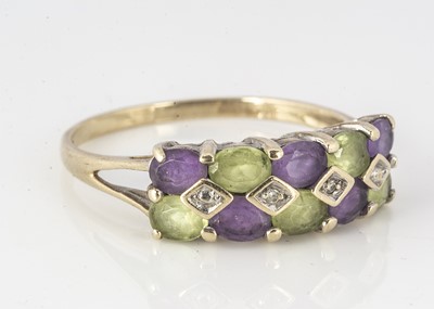 Lot 313 - A 9ct gold amethyst, peridot and diamond chequered board dress ring