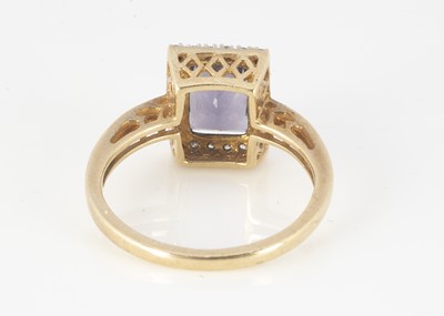 Lot 315 - A 9ct gold amethyst and diamond bezel cluster ring