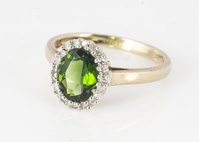 Lot 317 - A 9ct gold tourmaline and diamond cluster ring