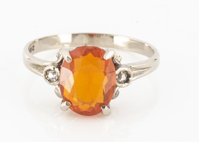 Lot 33 - An 18ct gold fire opal and diamond three stone dress ring