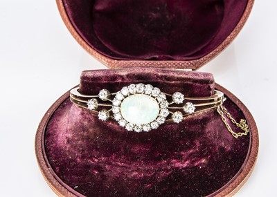 Lot 39 - An Edwardian precious opal and diamond bangle